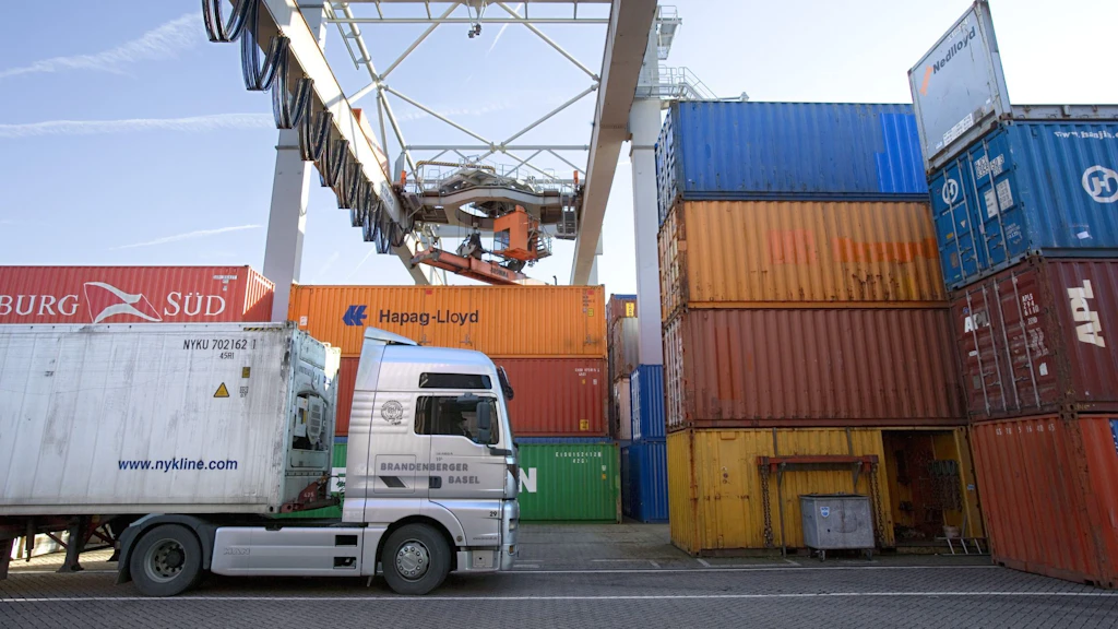Trucks and stacked containers.