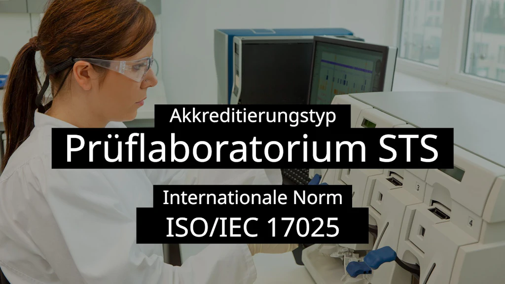 Laborantin mit Schutzbrille bei der Arbeit vor einem Analysegerät