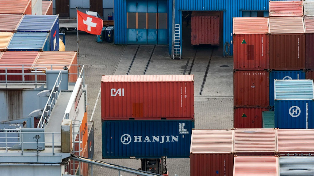 Freight container. It is the transshipment point. There is a Swiss flag there.