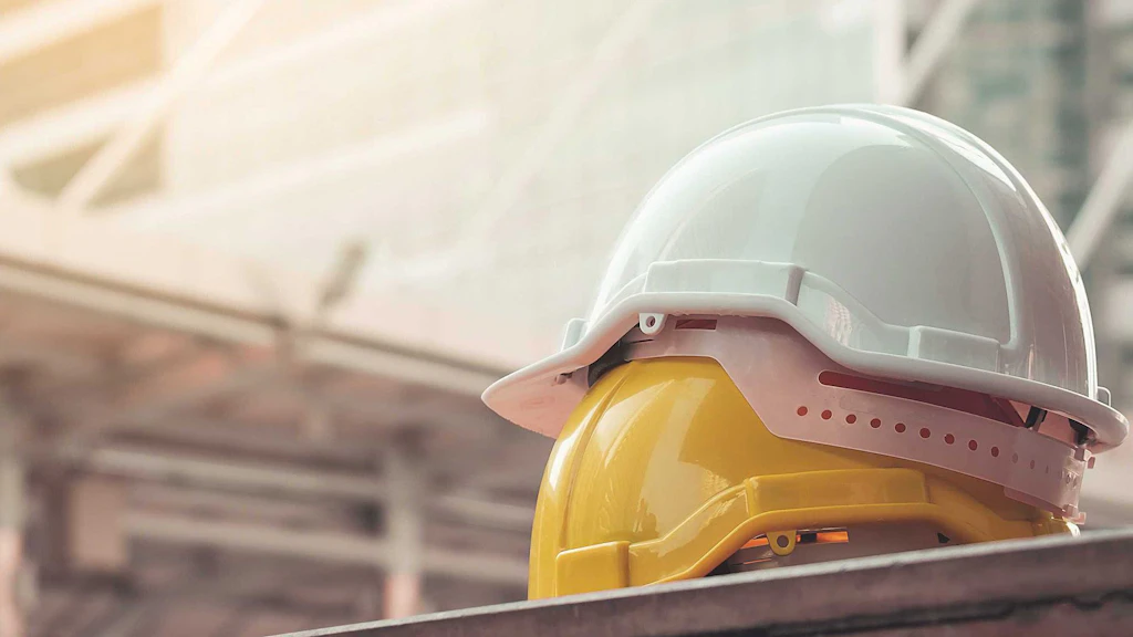Two helmets on a building site