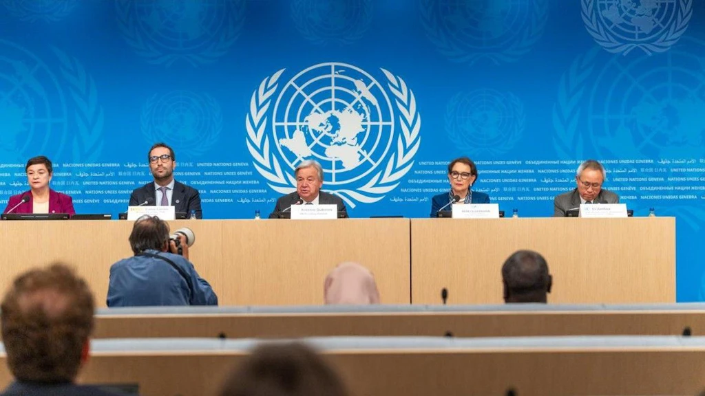 Secretary-General António Guterres (centre) briefs reporters during a press conference at Geneva.