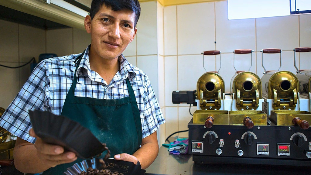 In a roasting plant, an employee shows the roasted beans.